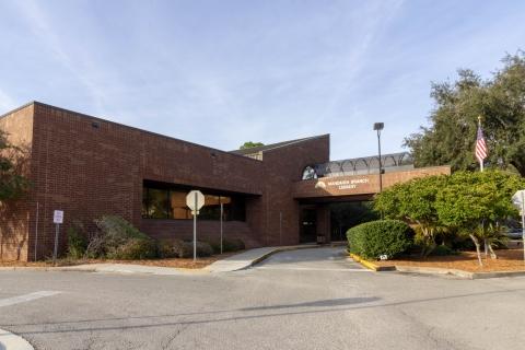 The Mandarin Branch Library seen from the car park: a low brick building with the branch name over the entrance.